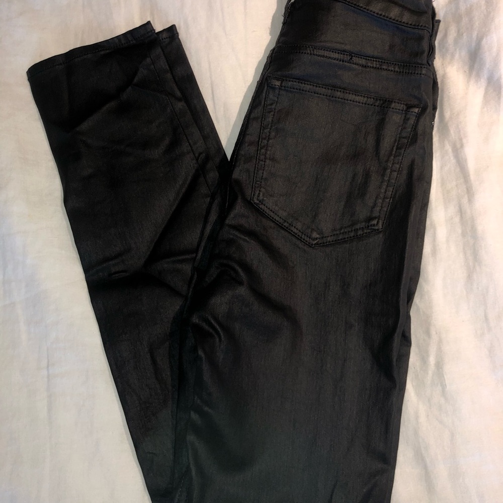 Waxed black skinny jeans